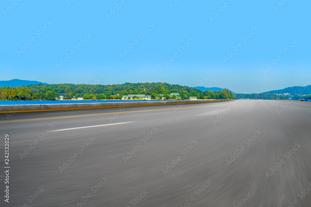 Empty asphalt road and natural landscape under the blue sky Empty asphalt road and natural landscape under the blue sky