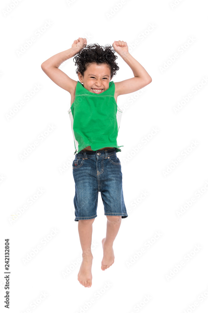 A Young Active Happy Boy Jumping in The Air A Young Active Happy Boy Jumping in The Air