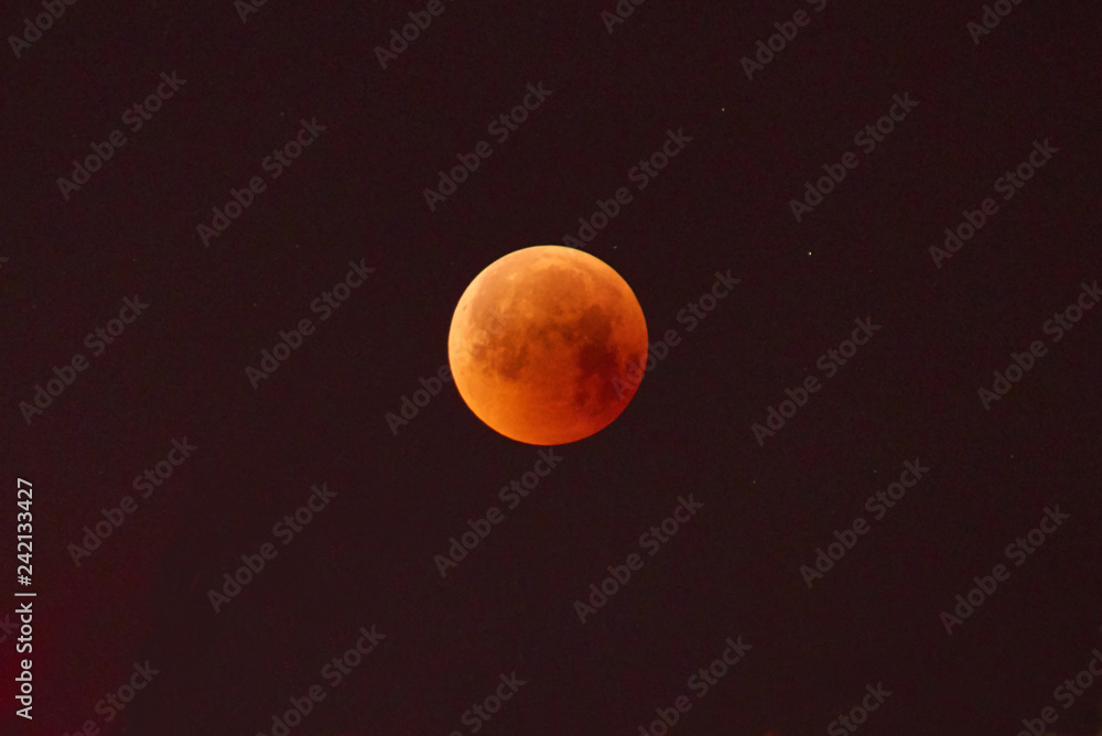 Red moon, total lunar eclipse. A total moon eclipse in the dark night