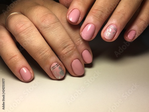 Fashionable gentle manicure with silver foil
