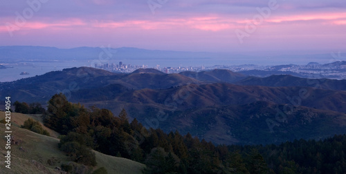 San Francisco Skyline peeping above the mountains from the Marin Headlands at Sunset