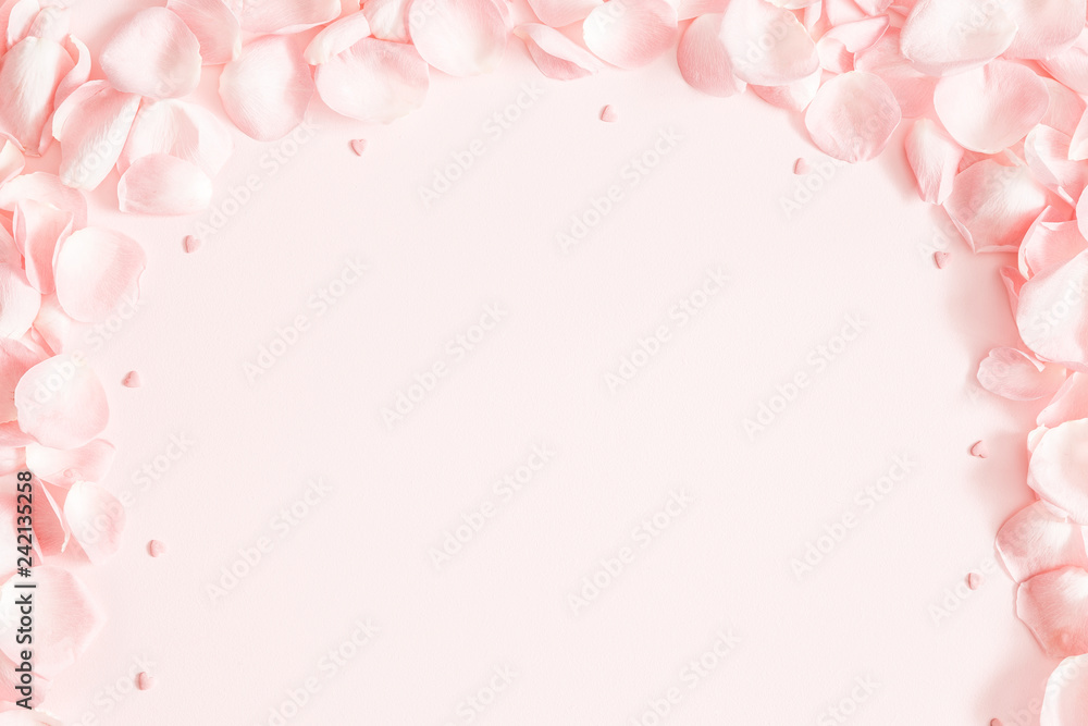 Flowers composition. Rose flower petals on pastel pink background. Valentine's Day, Mother's Day concept. Flat lay, top view, copy space