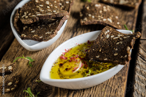 Rye bread crackers dipped in olive oil