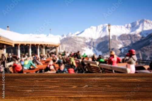 Winter table background in Alps and mountains landscape 
