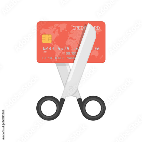 Scissors cutting credit card.