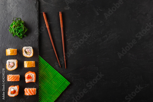 Set of sushi and maki on stone table. Top view with copy space
