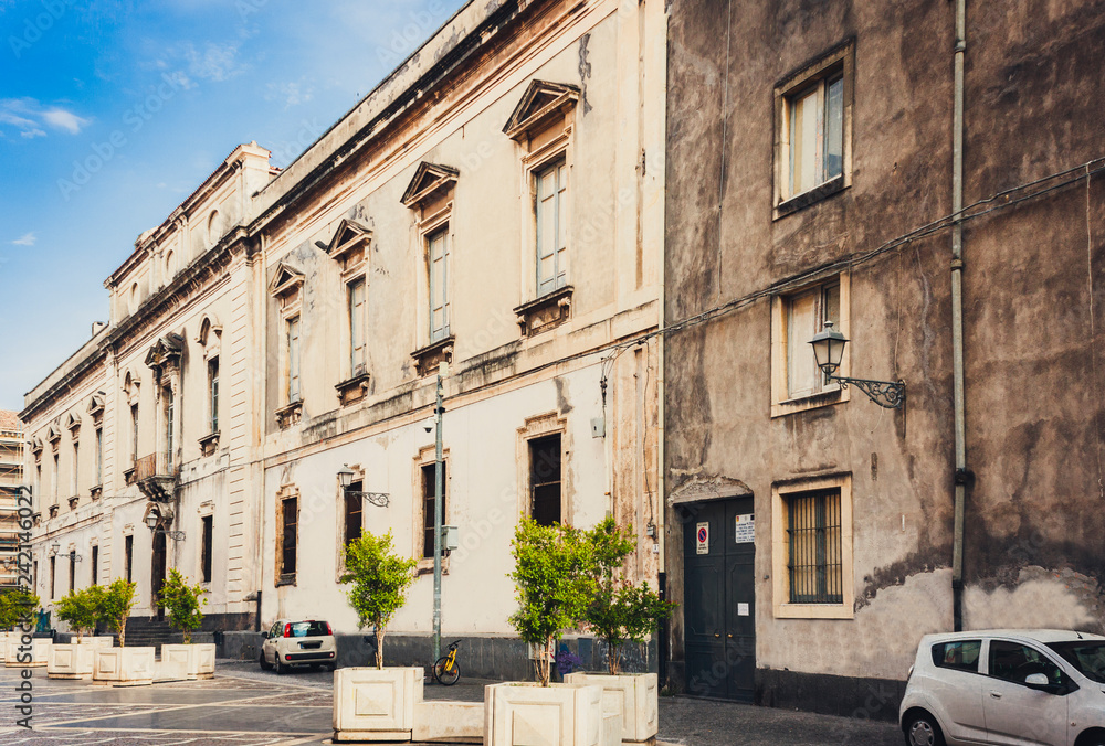 Travel to Italy -  historical street of Catania, Sicily, facade of old buildings.