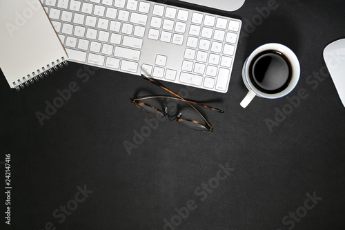 Dark leather workspace  and office gadget