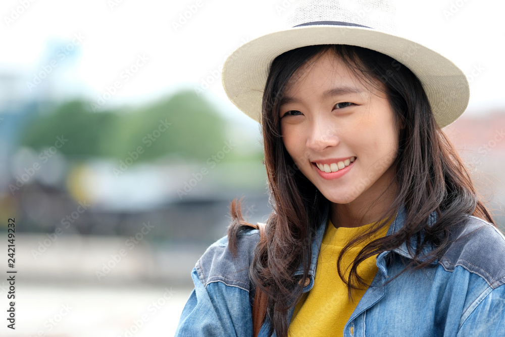 Young asian woman portrait smiling with happiness at city outdoors background, casual lifesyle, travel blogger Young asian woman portrait smiling with happiness at city outdoors background, casual lifesyle, travel blogger