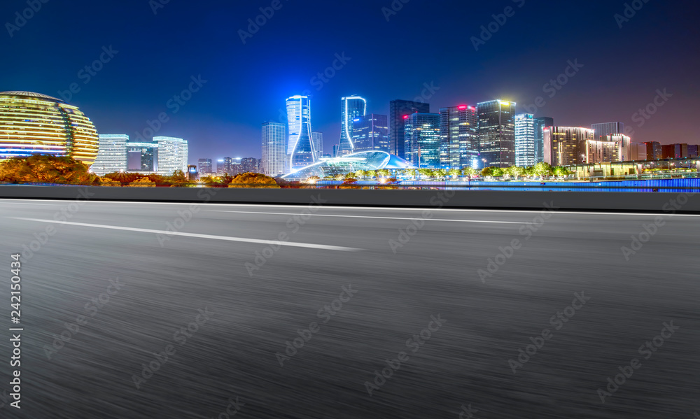 Road Pavement and Night View of Hangzhou Urban Architecture..