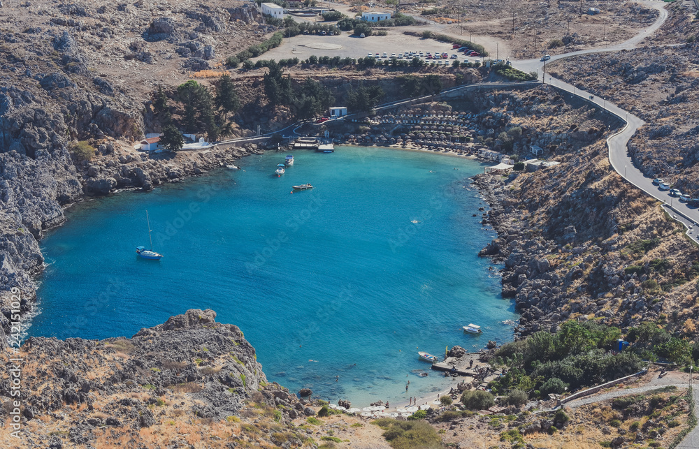 ACROPOLIS,LINDOS,RHODES/GREECE OCTOBER 26 2018 : The St Paul's bay(the heart of Lindos),view from the Acropolis.