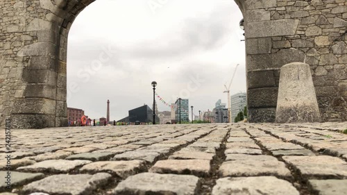 Low angle slide clip of arch entrance at Salthouse Dock  in Liverpool, UK photo