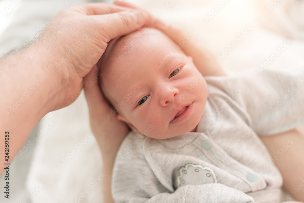 Baby in the hands of mom and dad close up. Baby in the hands of mom and dad close up.