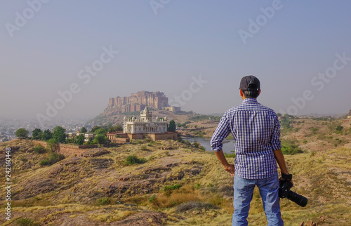 Canvas Print An Asian man standing on the hill