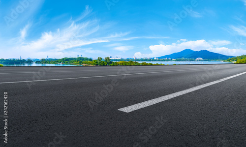 Empty asphalt road square and natural landscape under the blue sky