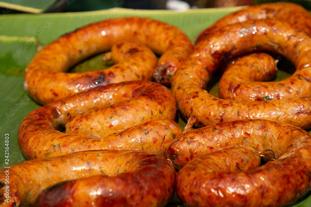 Thai spicy sausage grilled . local hot dog food . Thai spicy sausage grilled . local hot dog food .