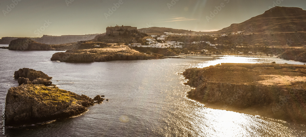 LINDOS,RHODES/GREECE OCTOBER 29 2018 : Lindos village and the endless Aegean sea photo taken from Kleovoulos Tomb hill.