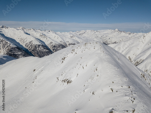 Aerial view of snow covered mountain peak in swiss alps