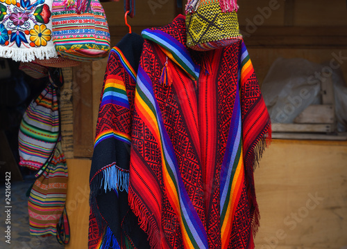 beautiful colorful Peruvian poncho in the market in Machu Picchu, one of the New Seven Wonder of The World, Cusco Region Peru, Urubamba Province. Selective focus