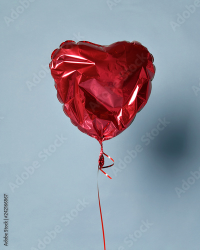 Party is over deflated red heart balloon object for birthday party or love valentines day