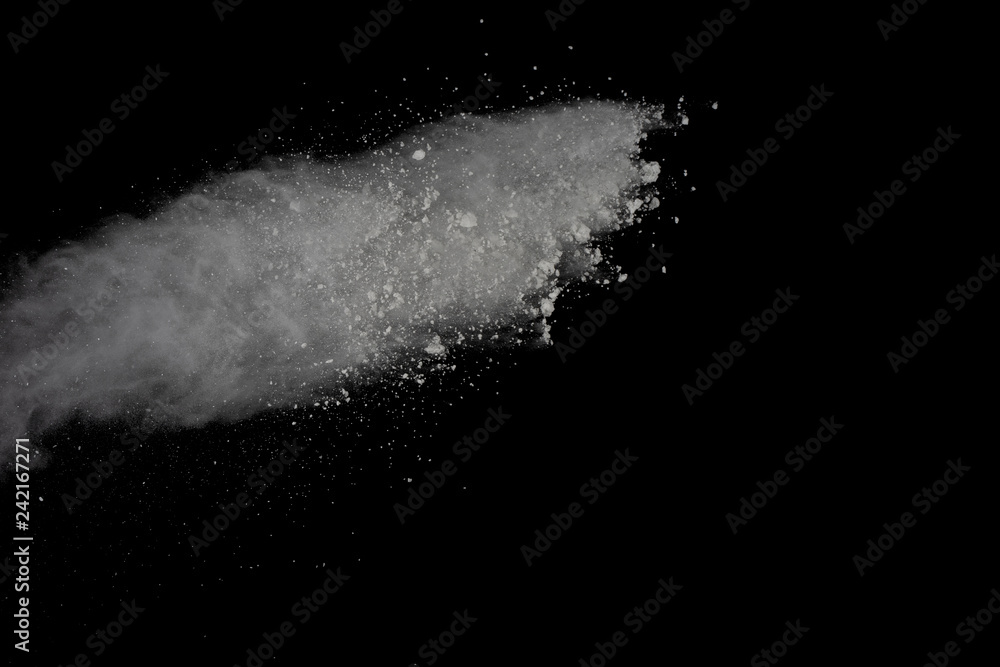 White powder explosion isolated on black background. White powder explosion isolated on black background.