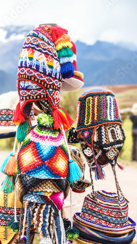 colorful Peruvian llama figures hats in local market in Machu Picchu, one of the New Seven Wonder of The World, Cusco Region Peru, Urubamba Province. Selective focus, traditional outfit