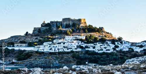 LINDOS,RHODES/GREECE OCTOBER 29 2018 : The Acropolis  and the village of Lindos photo taken from Kleovoulos Tomb hill photo