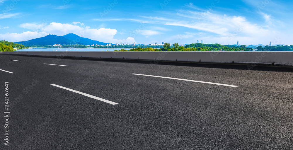 Empty asphalt road square and natural landscape under the blue sky Empty asphalt road square and natural landscape under the blue sky