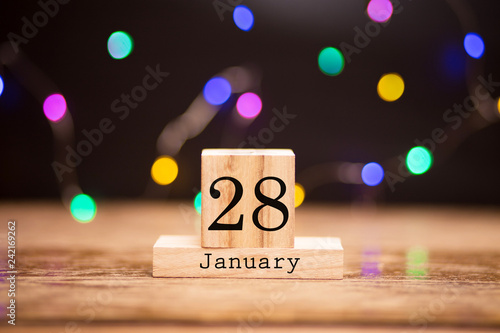 Wallpaper Mural January 28th. Day 28 of month at center of dark background with garland bokeh. Winter time, year concept. Torontodigital.ca