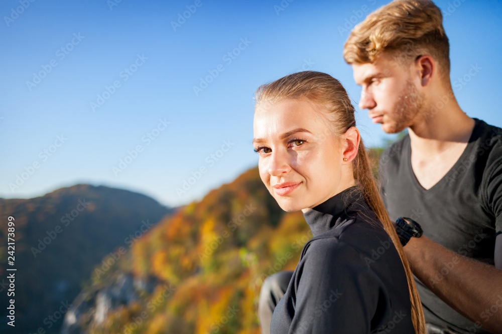 Couple of happy travelers in mountain