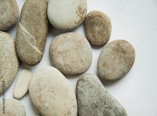 sea round stones, pebbles on white isolated background