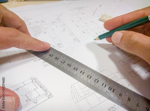 Person hands drawing Mechanical sheet drawing