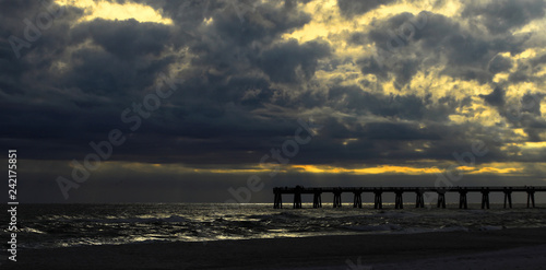 Fishing Pier at dusk with gathering storm