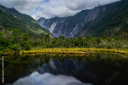 New Zealand tourist popular attractions destinations concept. Scenic landscape view of valley and Franz Josef Glacier in summer season  located at West Coast  South Island. 