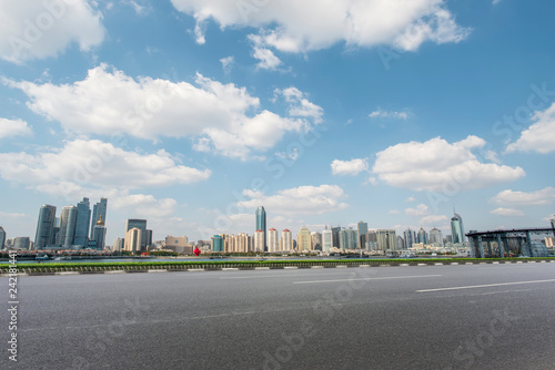 Empty asphalt road along modern commercial buildings in China,s cities