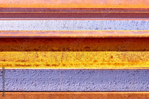 Striped abstract background. Corroded blue and yellow painted metal