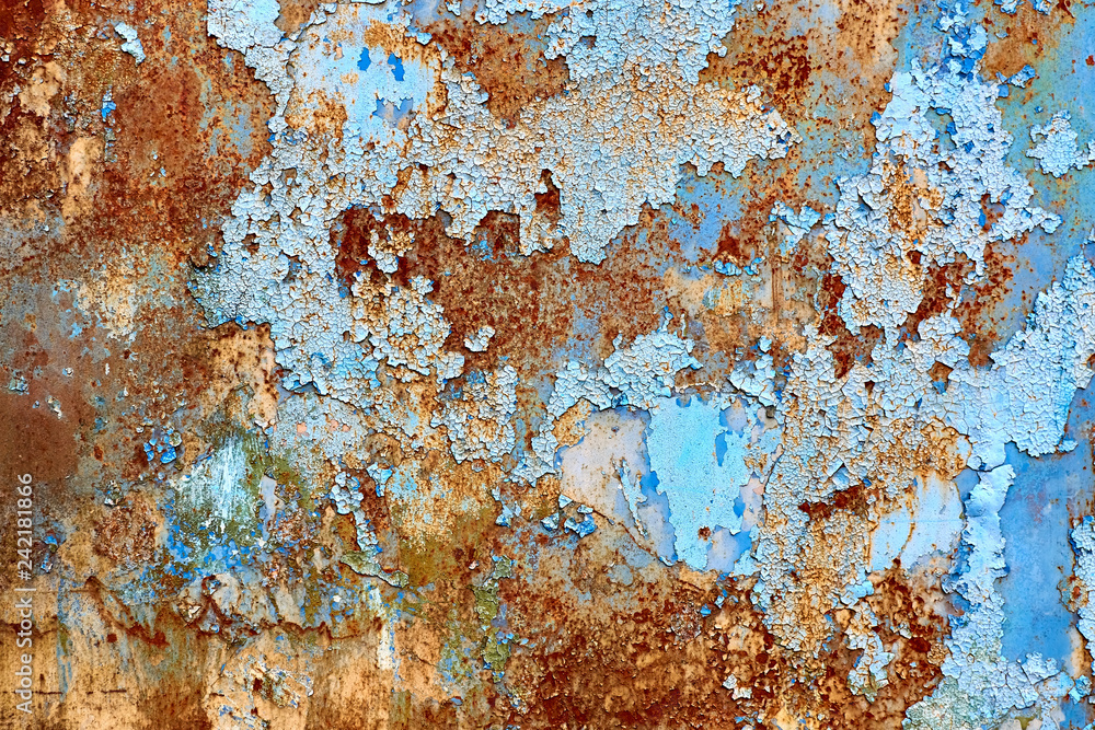 Rusted painted background. Peeled blue paint on metal wall. 