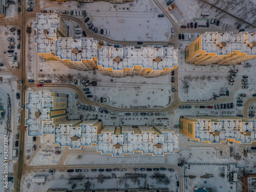 Top view of modern residential houses covered with snow