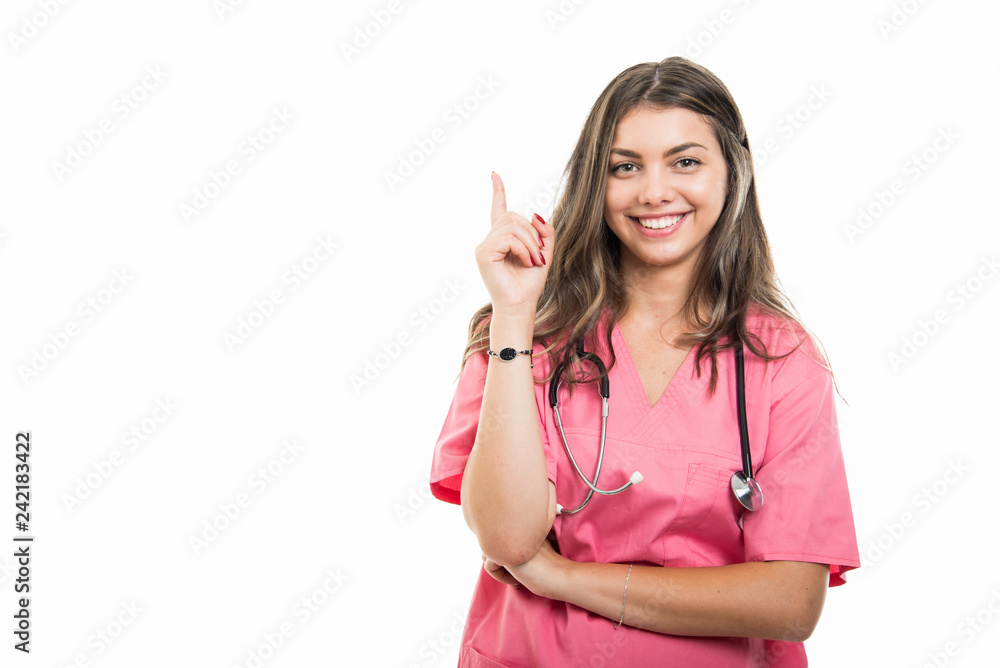 Portrait of beautiful young doctor wearing scrubs making good idea gesture Portrait of beautiful young doctor wearing scrubs making good idea gesture