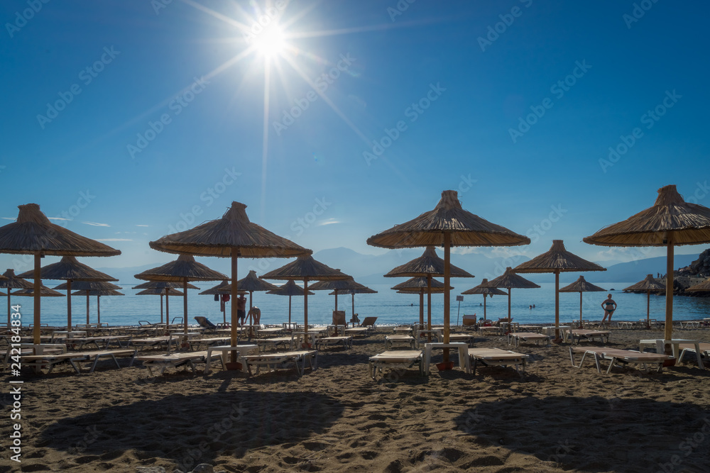 Agios Nikolaos, Crete - 10 01 2018: The city of Agios Nikolaos. Parasols on the beach