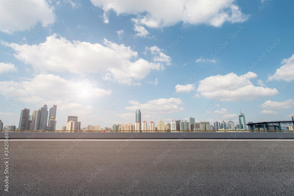 Empty asphalt road along modern commercial buildings in China,s cities