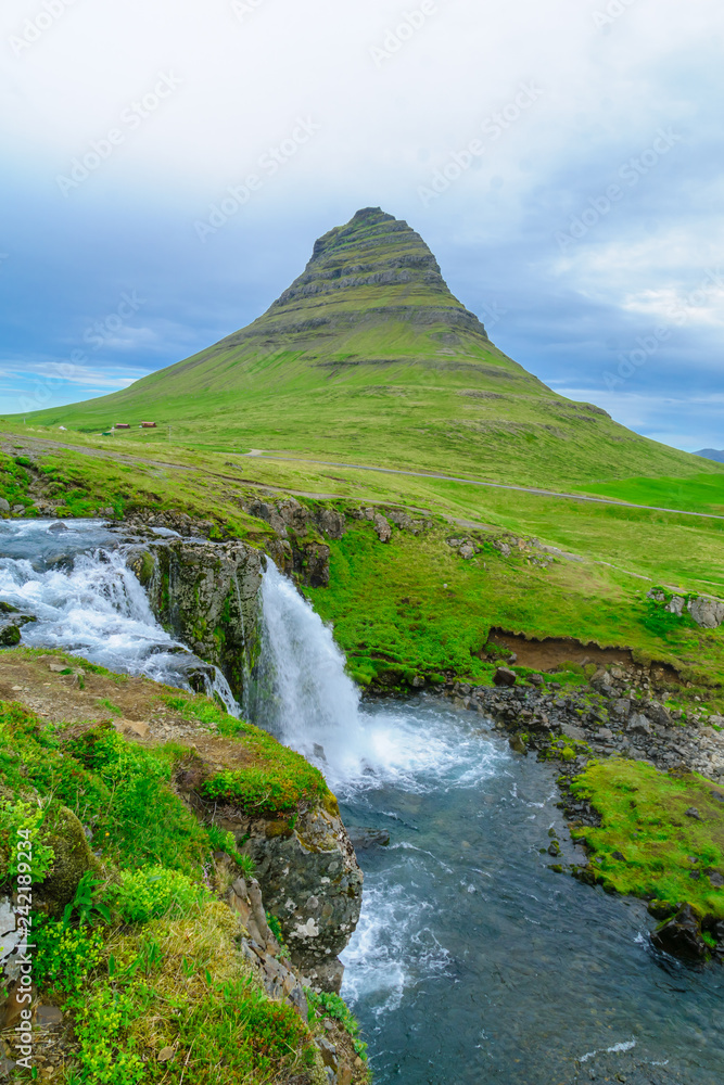Kirkjufell mountain , and the Kirkjufellsfoss waterfalls Kirkjufell mountain , and the Kirkjufellsfoss waterfalls