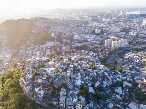 favelas house on the hills. Aerial photo of city Rio de Janeiro Brazil. narrow streets of the poor . Beautiful sunset backlight photo