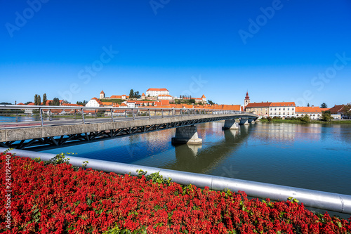 A view of the center of city of Ptuj, church, castle and old historical town of Ptuj, Slovenia. Blue sky, summer day in wine area of Ptuj, Ormoz and Jeruzalem. photo