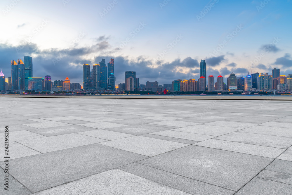 Empty marble floors and city views under the blue sky Empty marble floors and city views under the blue sky