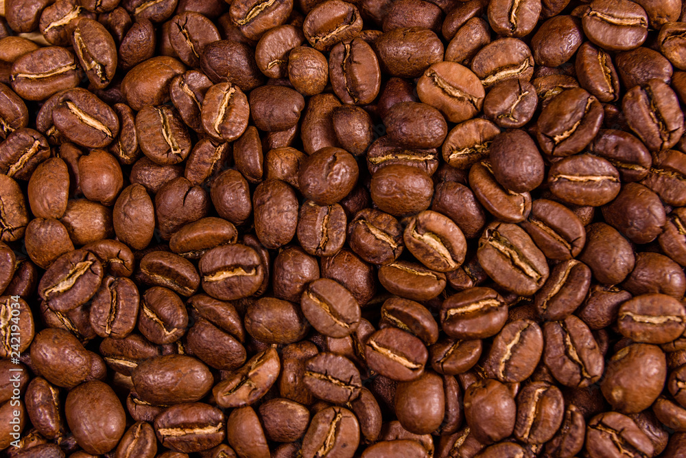 Fototapeta premium Background of many roasted coffee beans