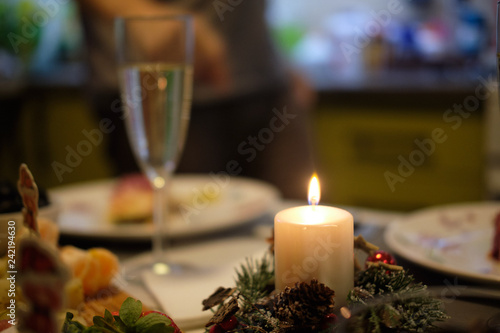 Glass of sparkling wine at a festive dinner blurred background