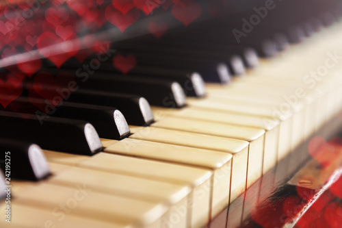 Wallpaper Mural Close-up of old piano keyboard, selective focus, soft toning. Valentine's day background, vintage piano and bokeh hearts Torontodigital.ca