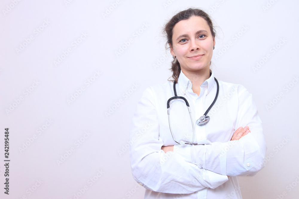 Woman doctor with stethoscope in white medical gown. Woman doctor with stethoscope in white medical gown.