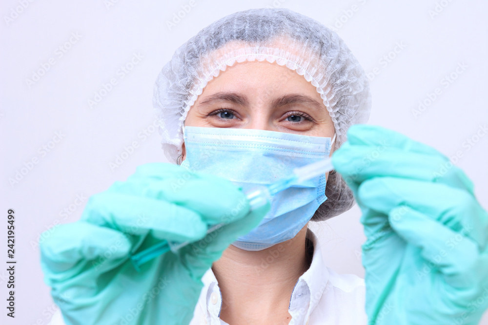 Medical worker with vaccine in syringe Medical worker with vaccine in syringe